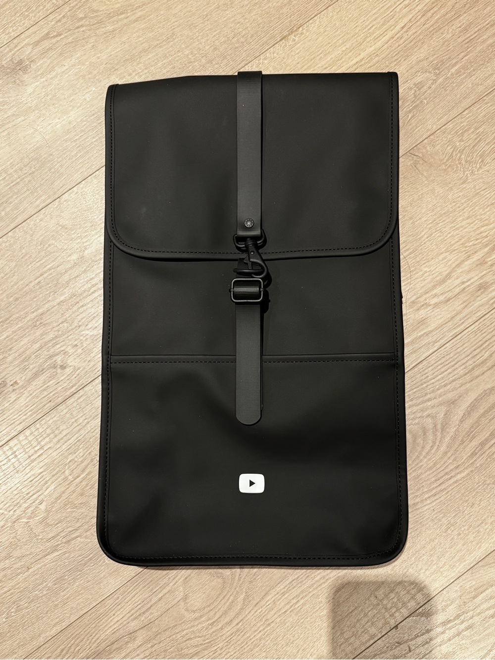 Rains Waterproof Black Backpack with YouTube Play Button Accent, NWT